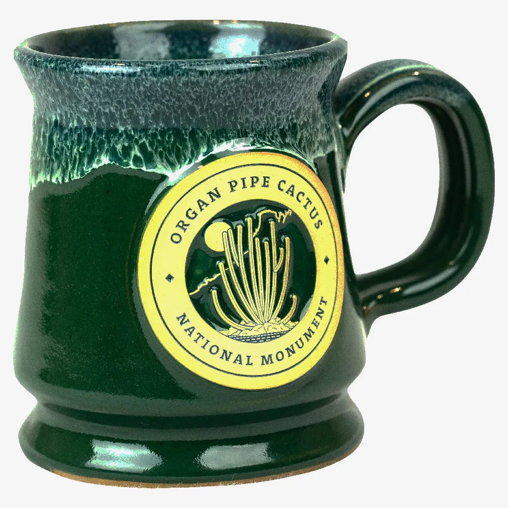 Green mug with 'Organ Pipe Cactus National Monument' logo on a white background
