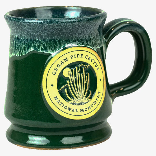 Green mug with 'Organ Pipe Cactus National Monument' logo on a white background
