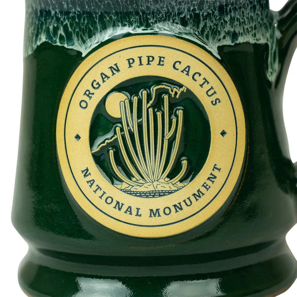 Green mug with Organ Pipe Cactus National Monument logo