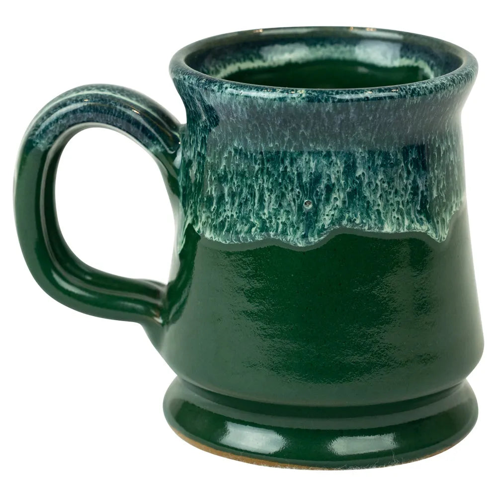 Green ceramic mug with textured surface on a white background