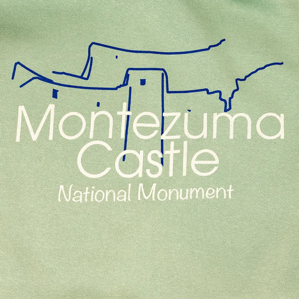 Outline of Montezuma Castle National Monument on a green background