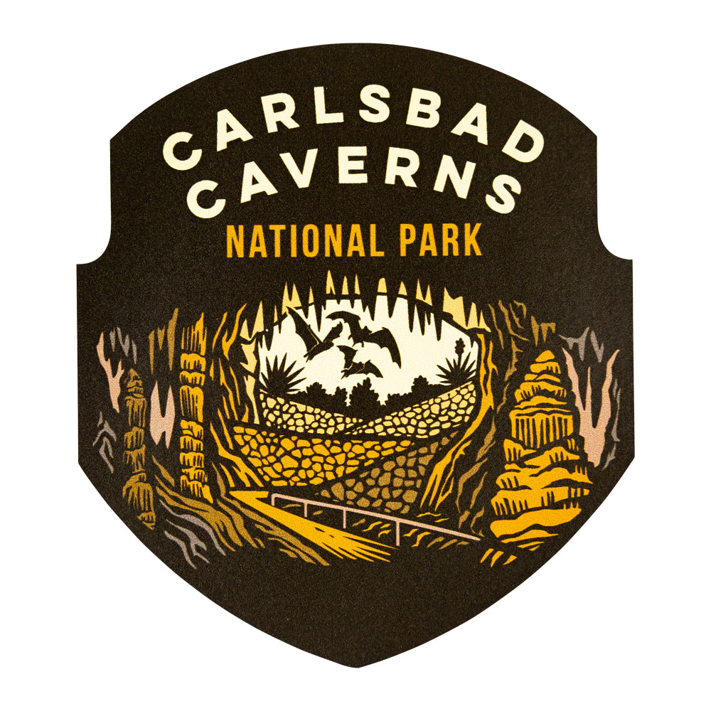 Carlsbad Caverns National Park logo sticker with yellow text and cave illustration on a black background