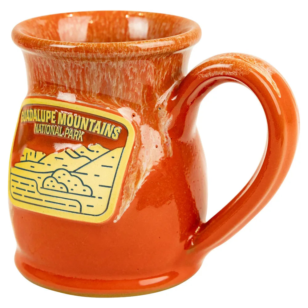 Orange mug with 'Guadalupe Mountains National Park' design on a white background