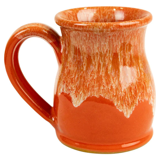 Orange ceramic mug with a textured surface on a white background