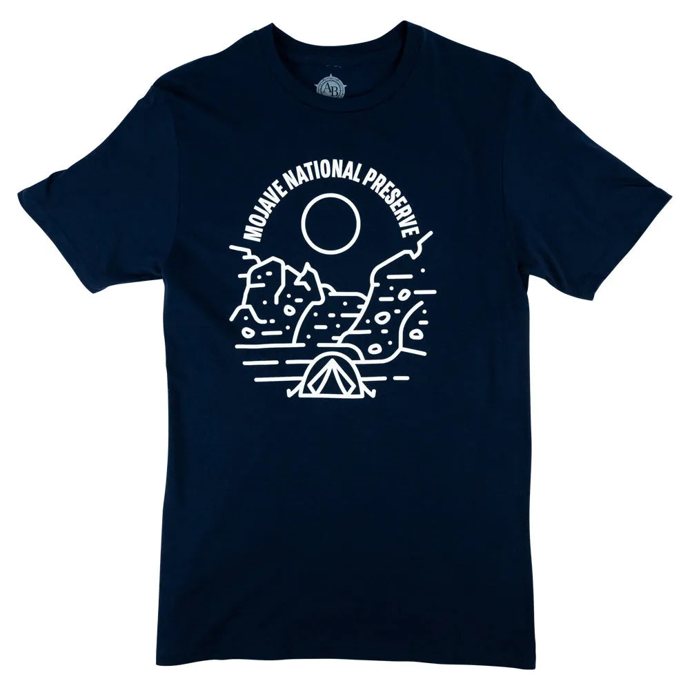 Navy blue t-shirt with white line art design of mountains, cactus, and tent, featuring 'Mojave National Preserve' text on a white background.