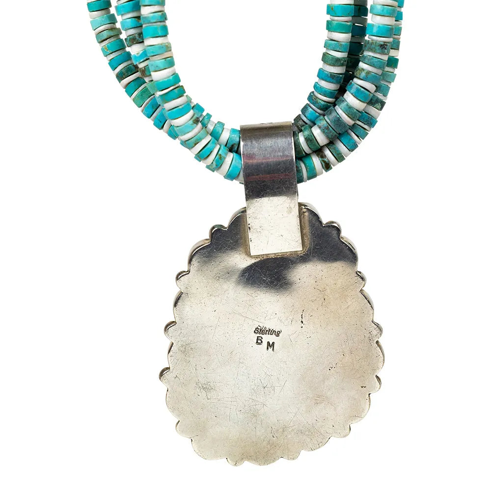Necklace with turquoise and white beads and a silver pendant showing BM hallmark on a white background