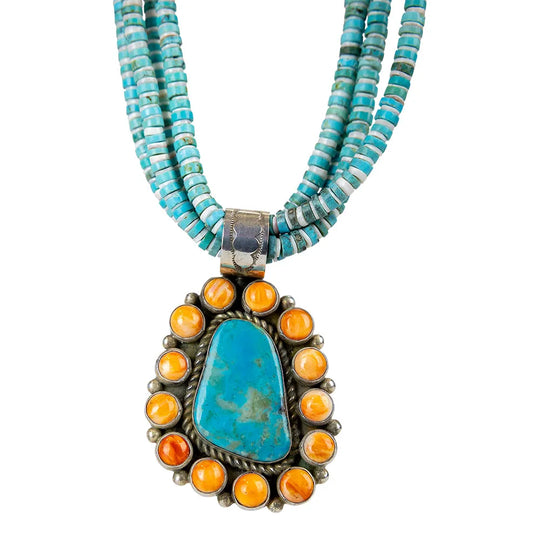 Turquoise and spiny oyster stone pendant with silver clasp attached to multi-stranded bead necklace on a white background