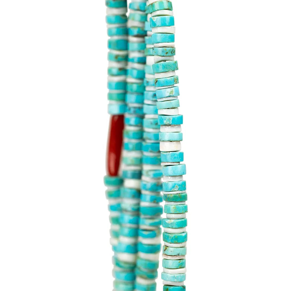 Turquoise and white beaded Navajo necklace closeup on a white background