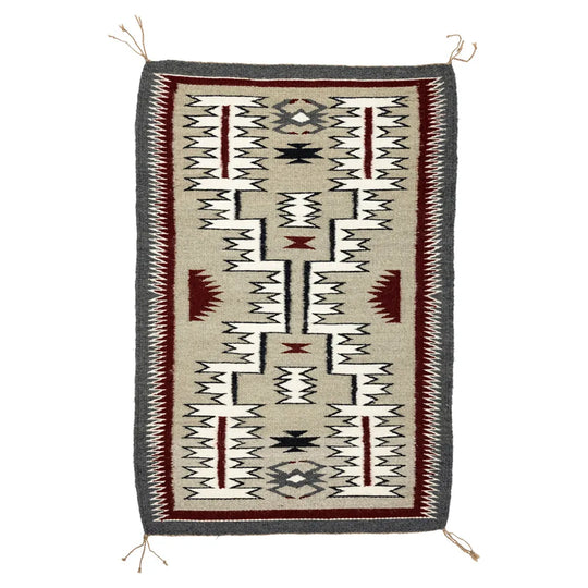 Storm pattern Navajo rug by Nita Nez on white background
