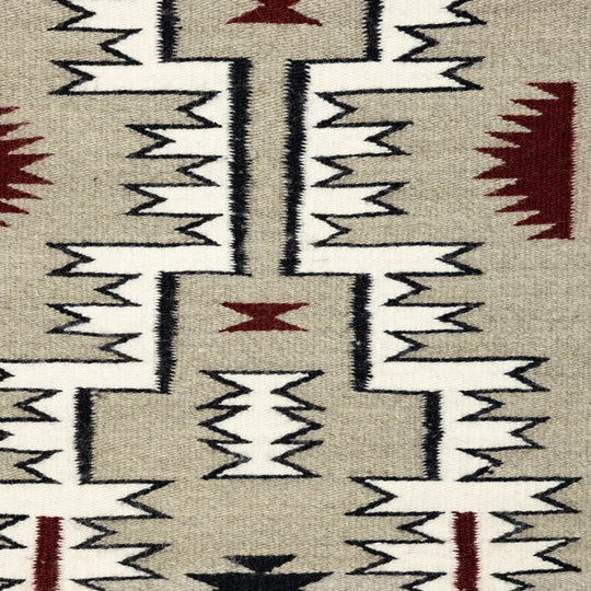 Close-up of the center section of a Navajo storm patterned rug.