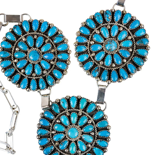 Turquoise floral jewelry set with necklace and earrings on a white background