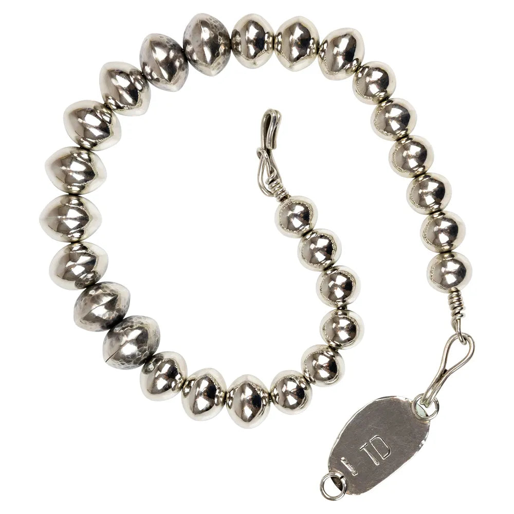 Silver beaded choker necklace with a green and blue stone clasp on a white background