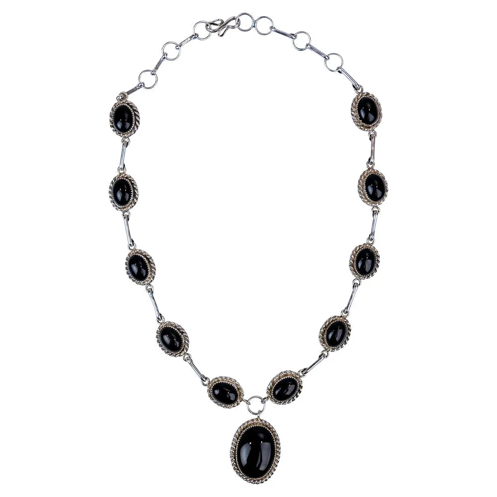 Sterling silver necklace with onyx on a white background
