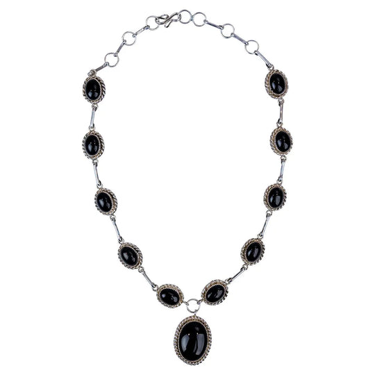 Sterling silver necklace with onyx on a white background