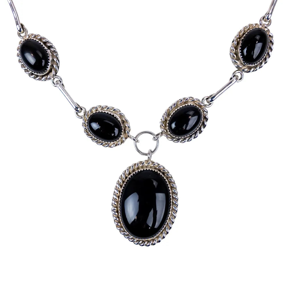 Sterling silver necklace with onyx on a white background