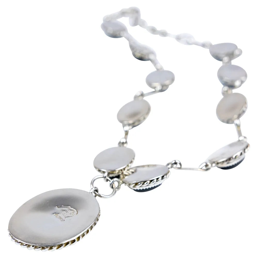 Sterling silver necklace with onyx on a white background