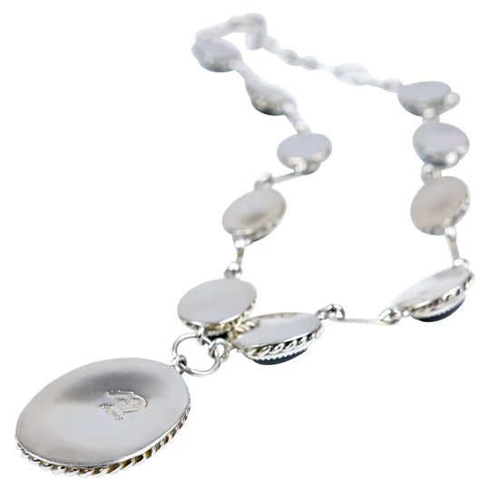 Sterling silver necklace with onyx on a white background