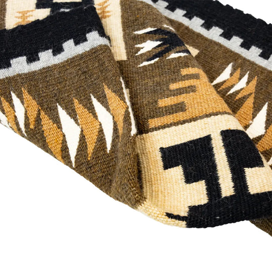 Close-up of a woven fabric with geometric pattern on a white background