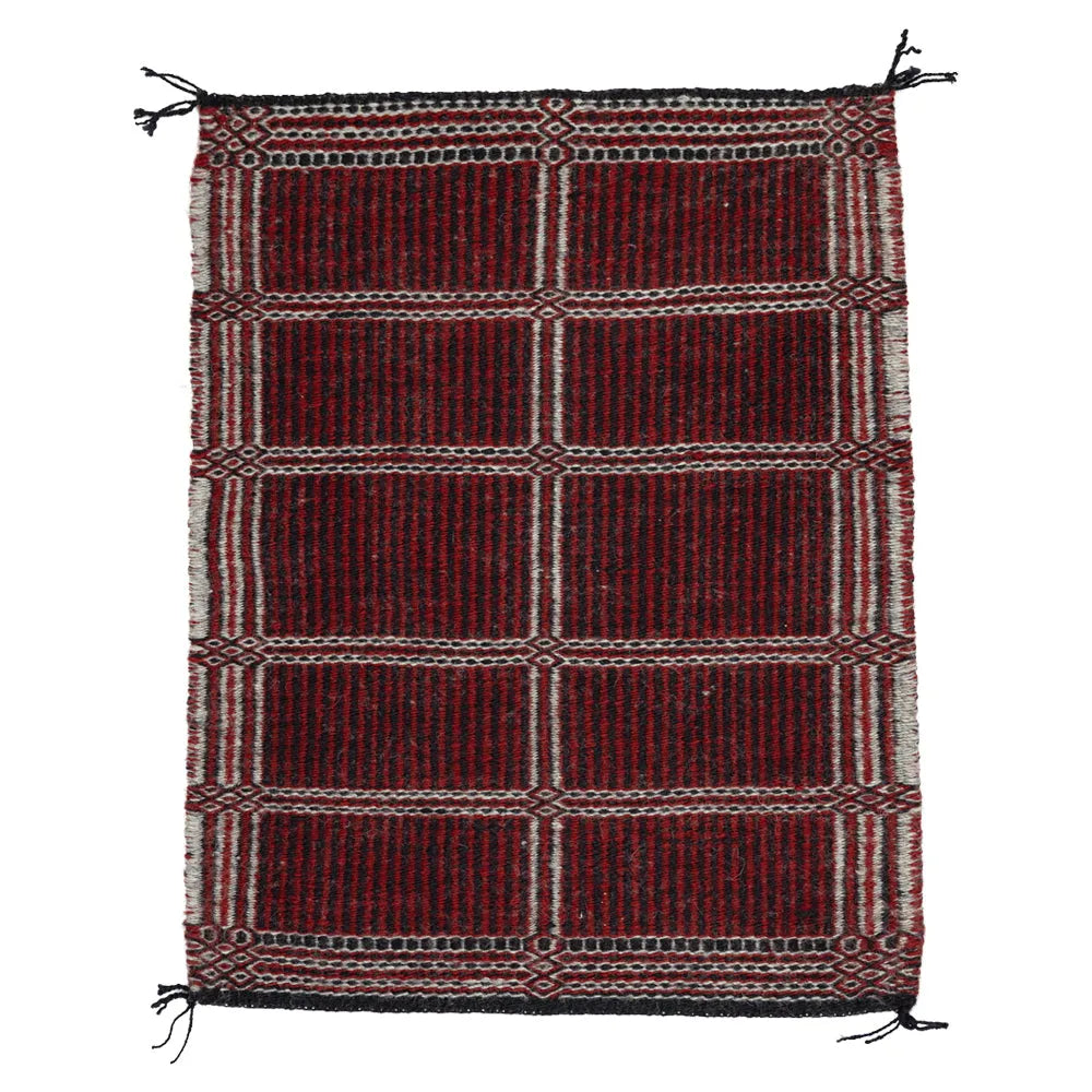 Side two of Two-Faced Navajo Rug by Rosebelle Nez on white background.