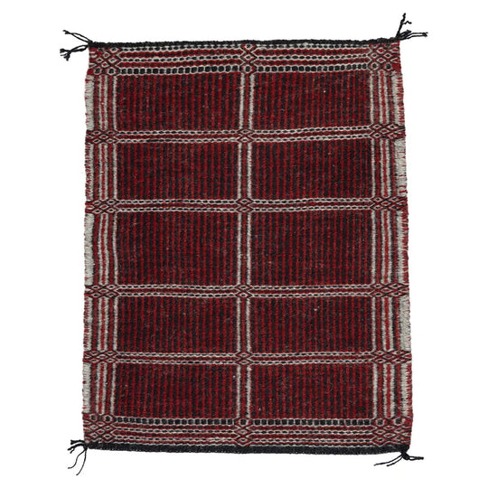 Side two of Two-Faced Navajo Rug by Rosebelle Nez on white background.