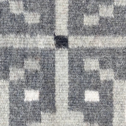 Close-up of a textured gray and white patterned fabric