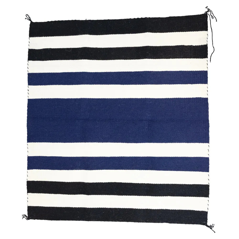 Striped Navajo blanket with black, white, and blue horizontal stripes on a white background