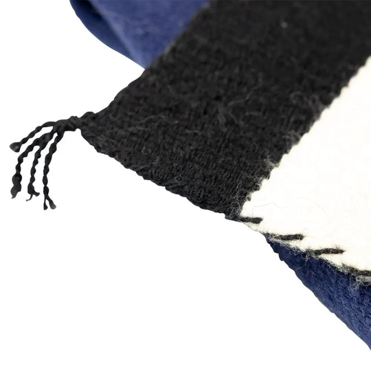 Striped Navajo blanket with black, white, and blue horizontal stripes on a white background