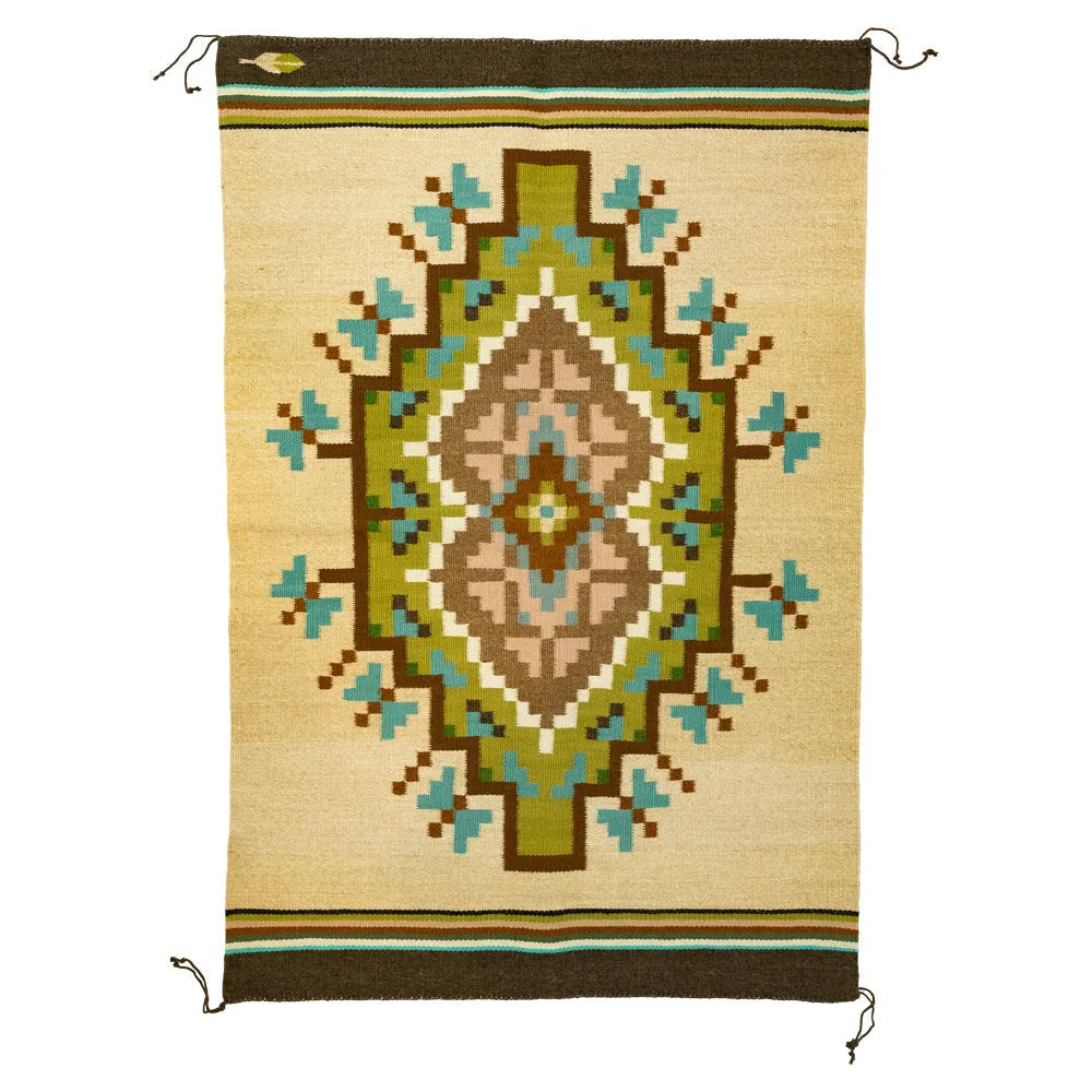 Handwoven Burntwater rug by Judy Nelson. Natural wool and plant-dyed hues create the Butterfly Rug, rich in Navajo tradition and artistry.
