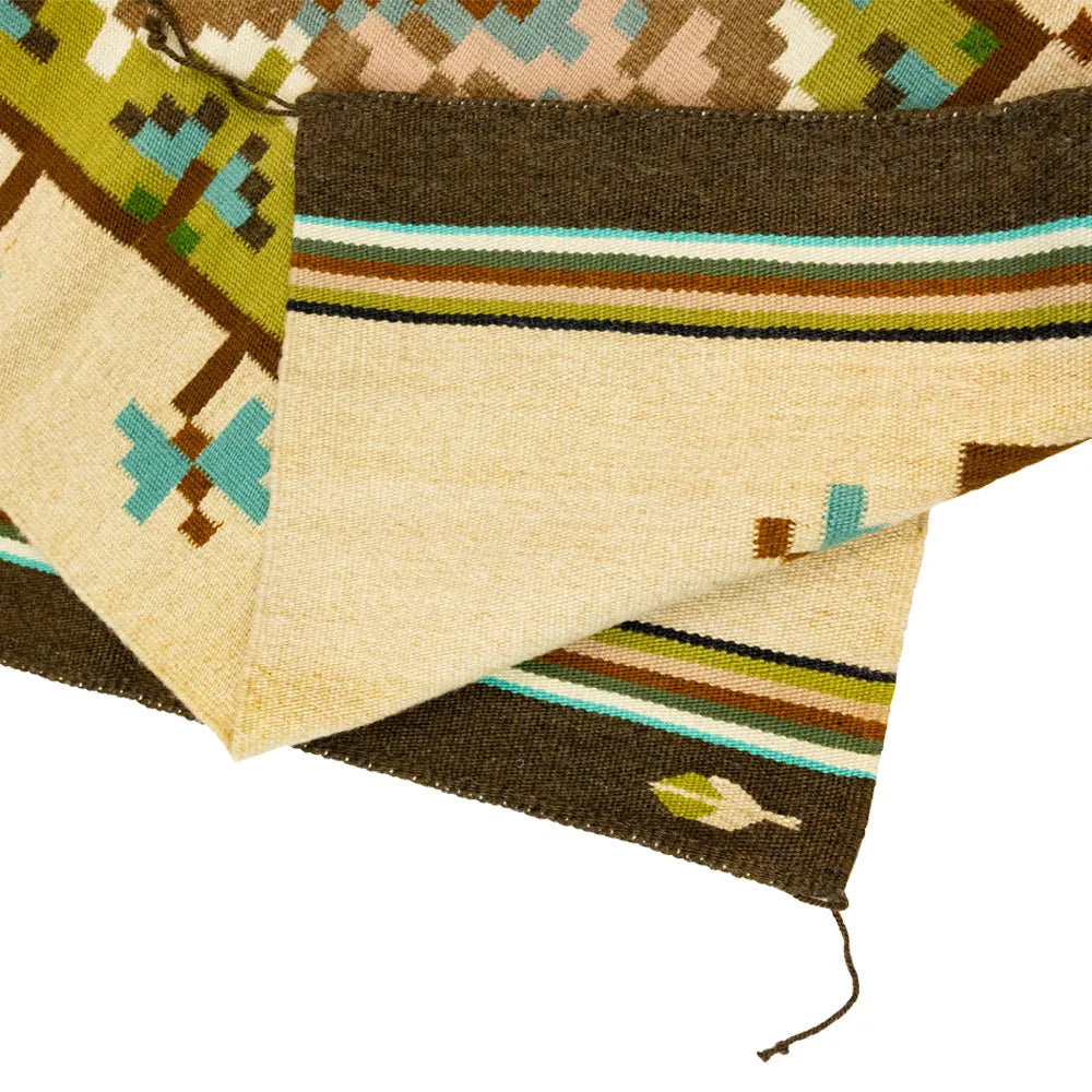 Handwoven Burntwater rug by Judy Nelson. Natural wool and plant-dyed hues create the Butterfly Rug, rich in Navajo tradition and artistry.