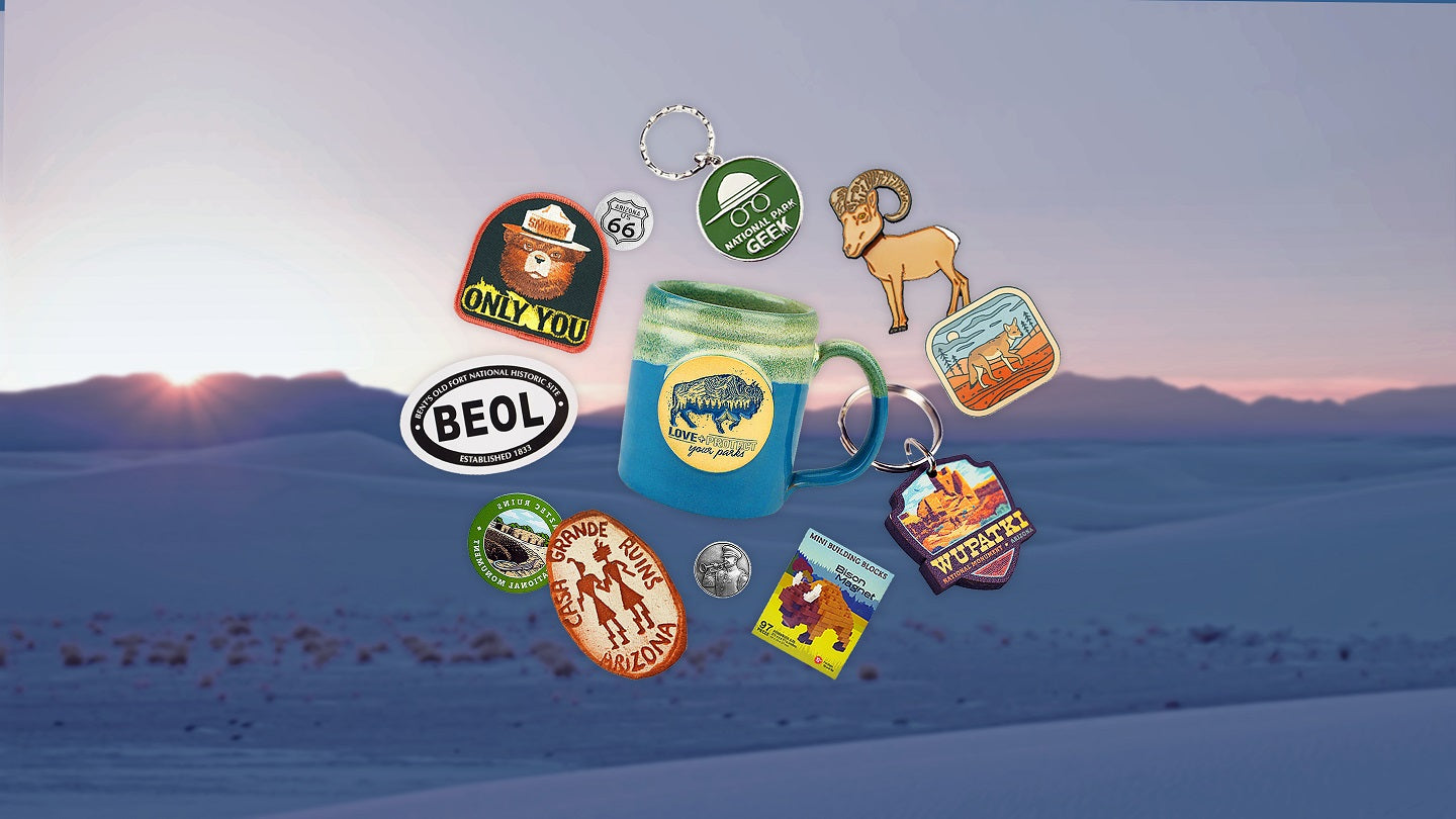 Collection of various collectible products against a desert landscape.