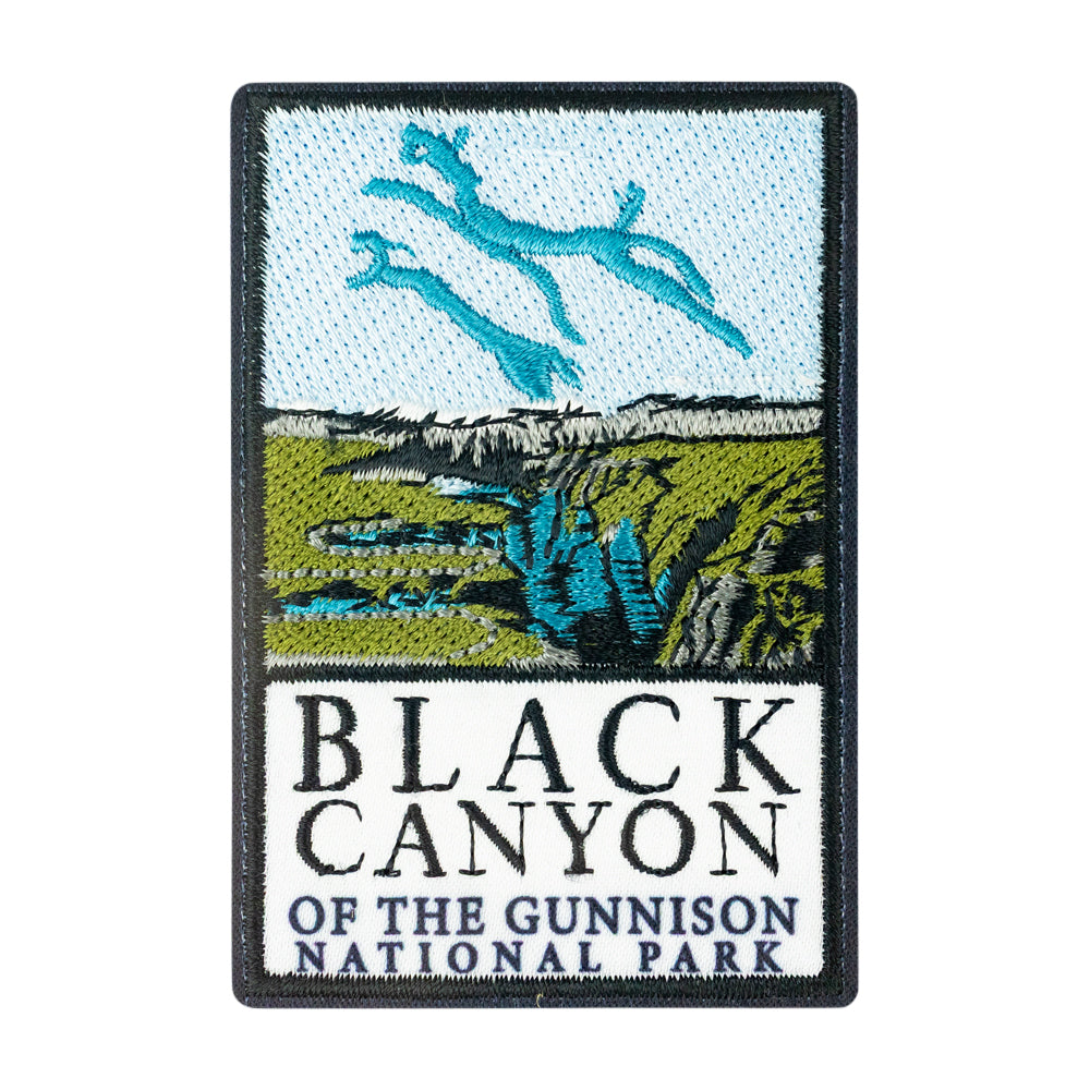 An embroidered rectangular patch featuring a scenic Black Canyon of the Gunnison National Park design with blue sky, green canyon walls, and large black text reading 'BLACK CANYON OF THE GUNNISON NATIONAL PARK' on a white background.