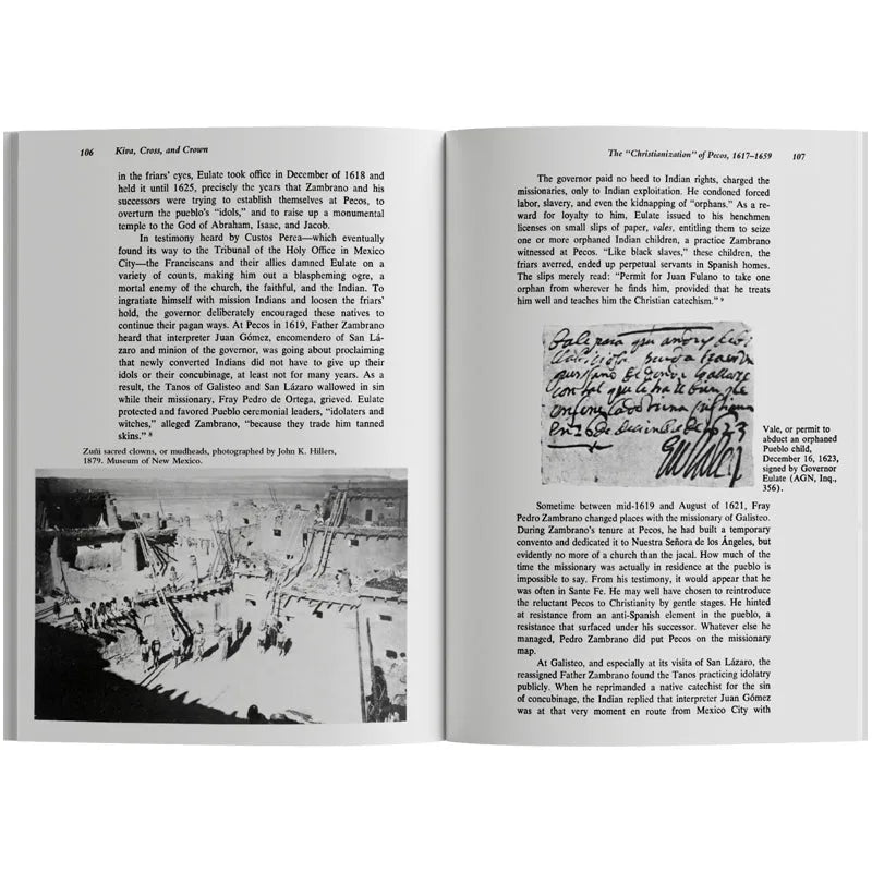 Open book with text and a black and white photograph on a white background