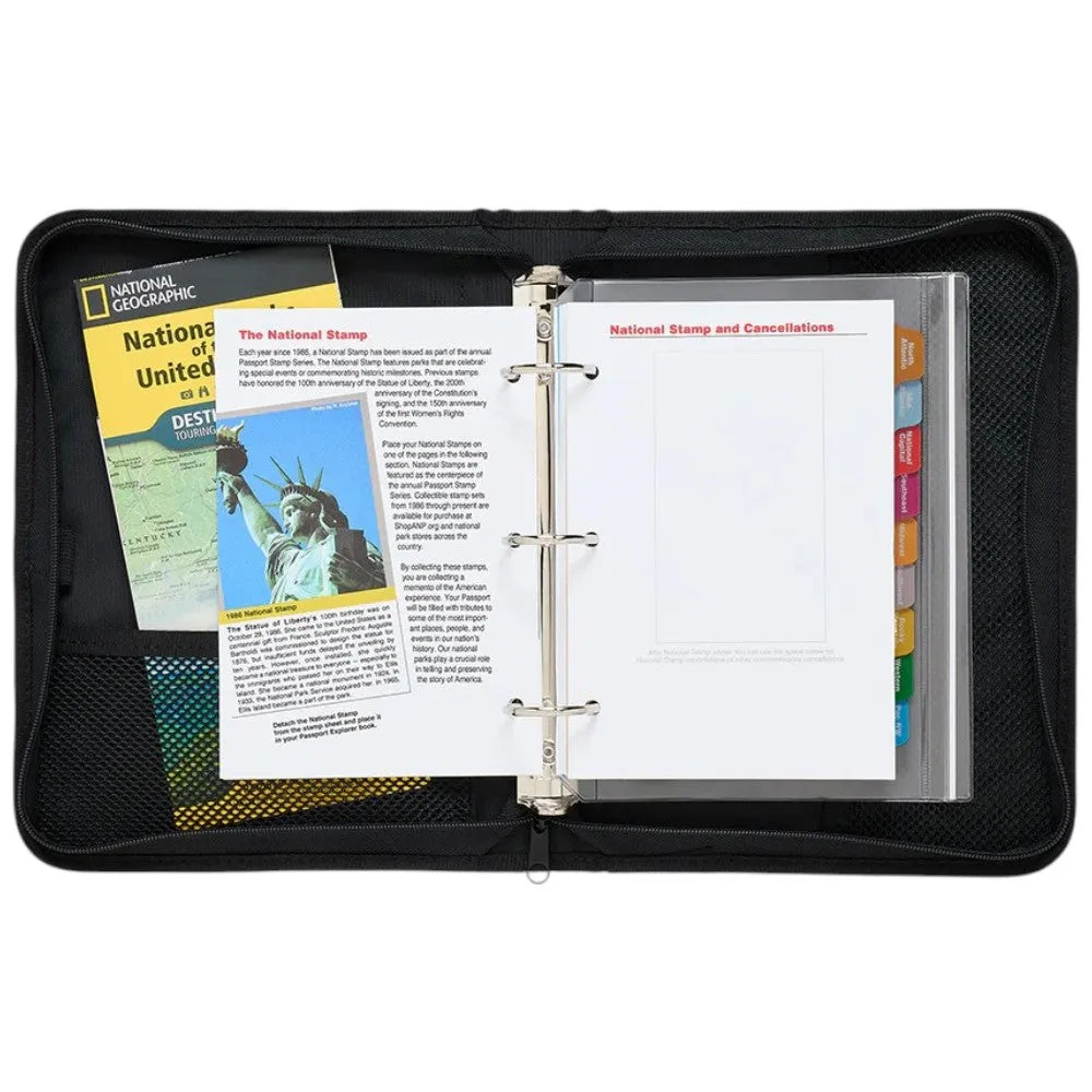 Black binders with National Geographic and stamp collection materials on a white background