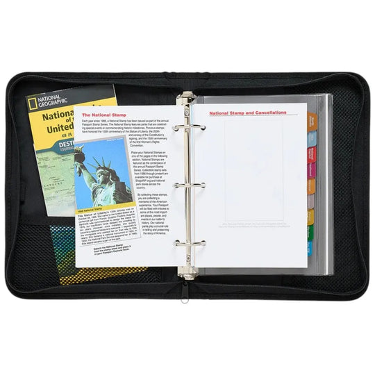 Black binders with National Geographic and stamp collection materials on a white background