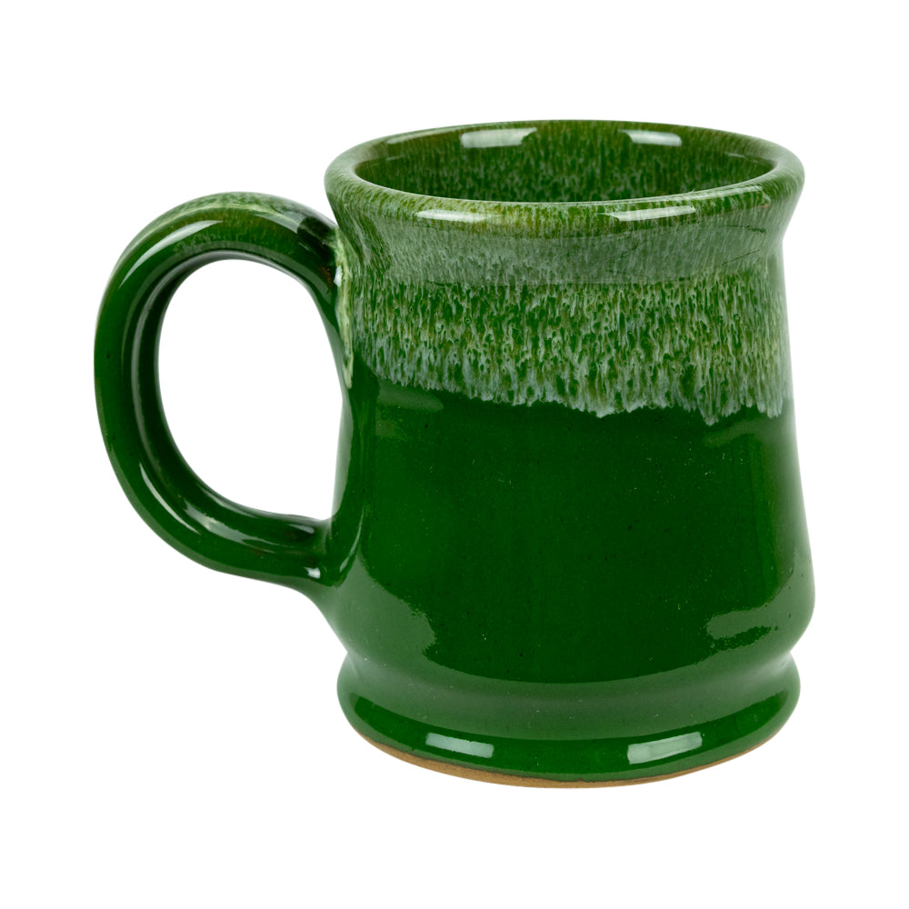 A green glazed ceramic mug with a thick handle and a textured, dripping glaze pattern near the rim, shown on a plain white background.