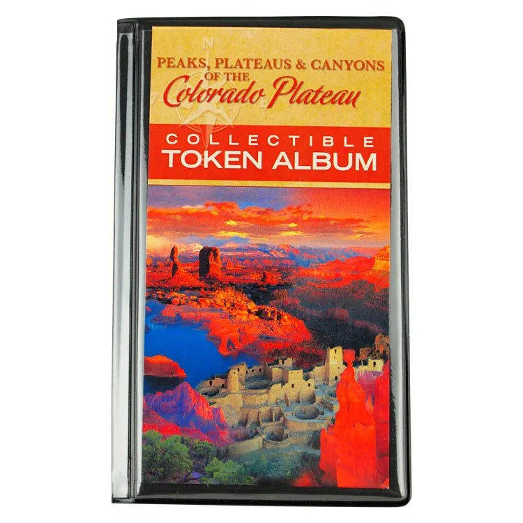 A collectible token album with a colorful cover featuring a landscape of the Colorado Plateau.