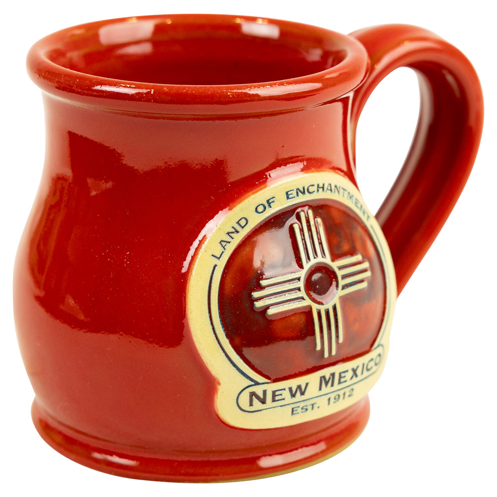 Red mug with New Mexico logo on a white background