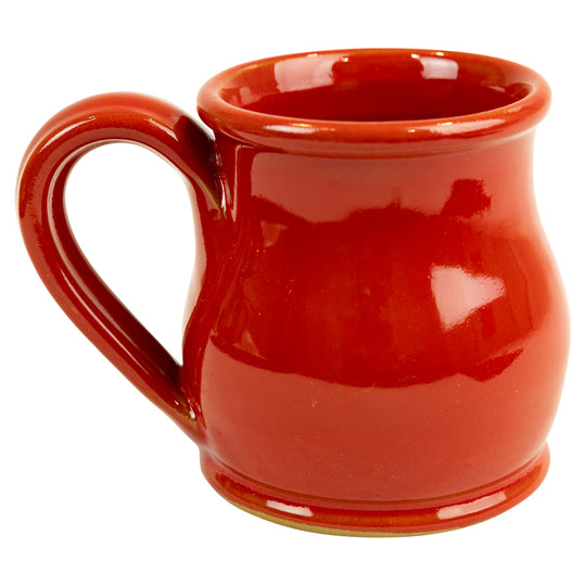 Red ceramic mug on a white background