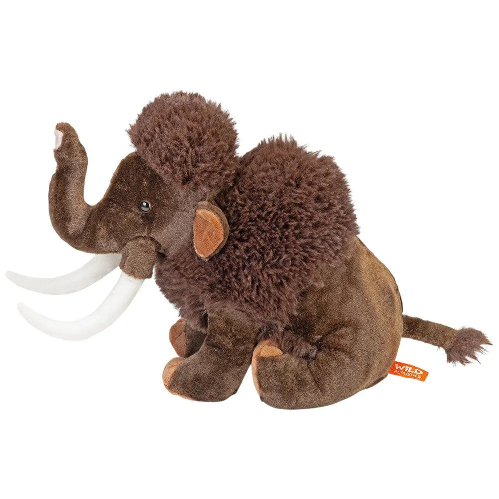Plush toy mammoth with brown fur and white tusks on a white background