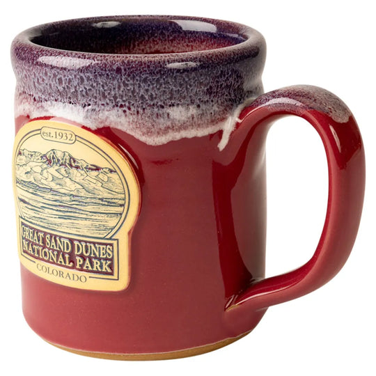 Cranberry mug with Great Sand Dunes National Park logo on a white background
