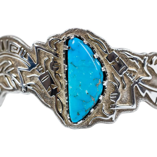 Silver bracelet with turquoise stone on a white background