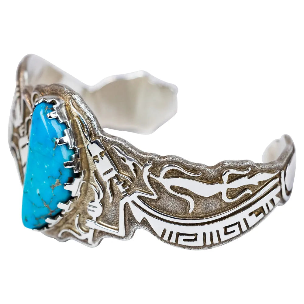Silver bracelet with turquoise stone on a white background