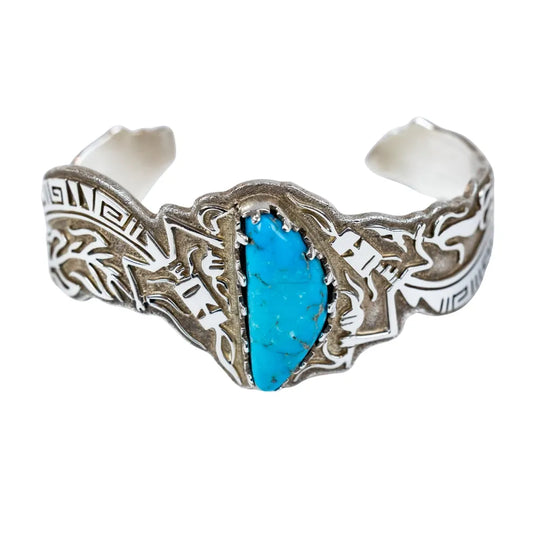 Silver bracelet with turquoise stone on a white background