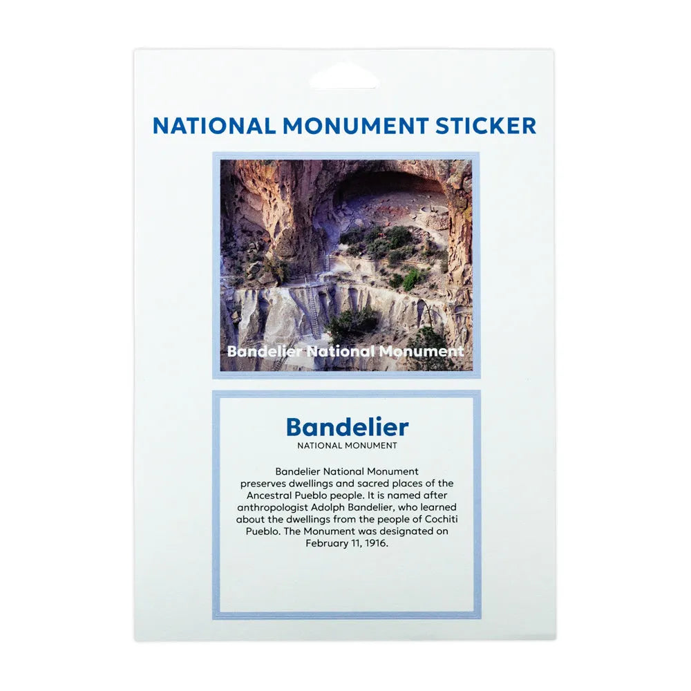 A National Monument Sticker card for Bandelier National Monument, featuring a scenic photo of the canyon and waterfall, with descriptive text on a white card.