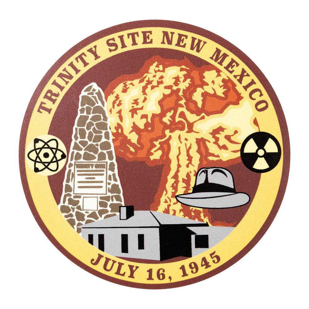 Logo of Trinity Site New Mexico with atomic explosion, mushroom cloud, and historical building.