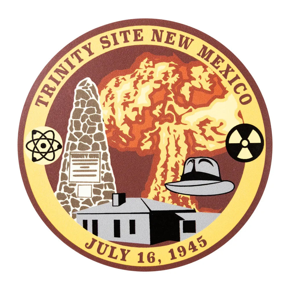 Logo of Trinity Site New Mexico with atomic explosion, mushroom cloud, and historical building.