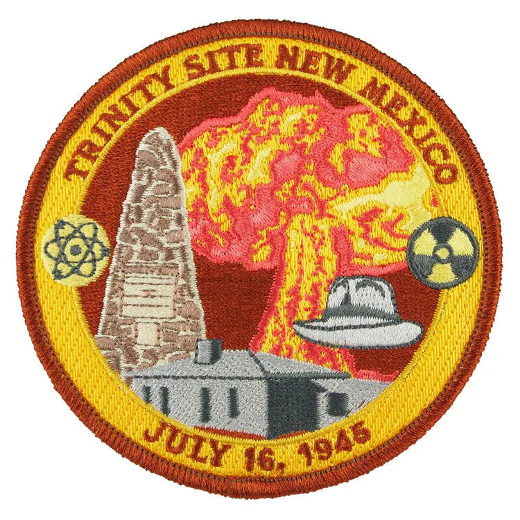 Circular patch with atomic bomb explosion, atomic symbol, and insignias, featuring &
