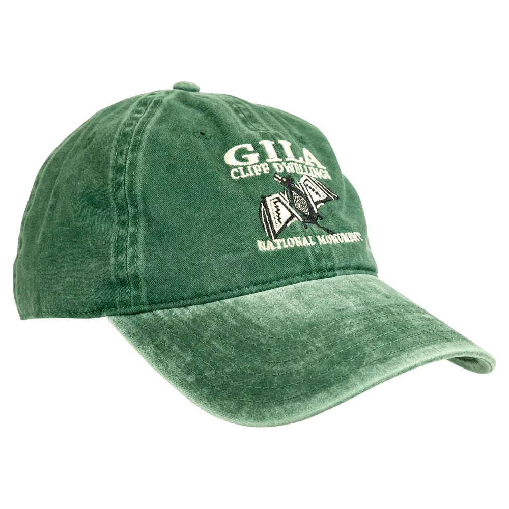 A green washed baseball cap featuring embroidered text and a graphic on the front that reads 'GILA CLIFF DWELLINGS NATIONAL MONUMENT' with an illustration.