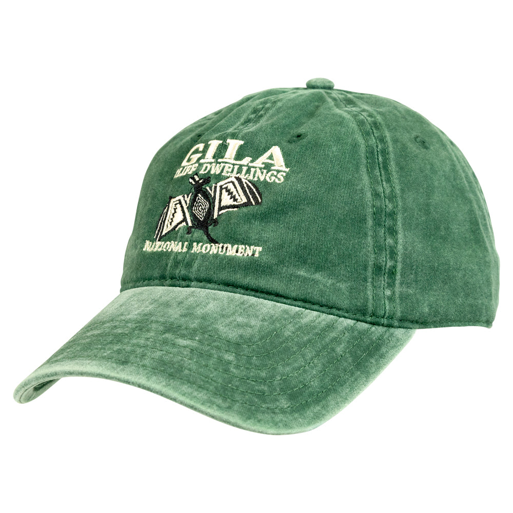 A green washed baseball cap featuring embroidered text and a graphic on the front that reads &