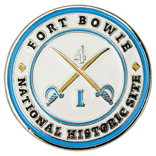 Circular badge with 'Fort Bowie National Historic Site' text and crossed swords design on a white background